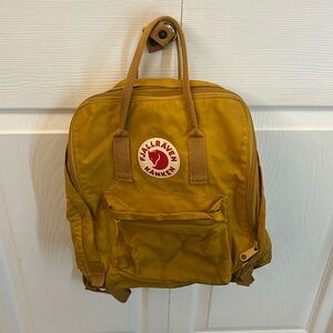 Fjällräven kånken mustard yellow backpack
